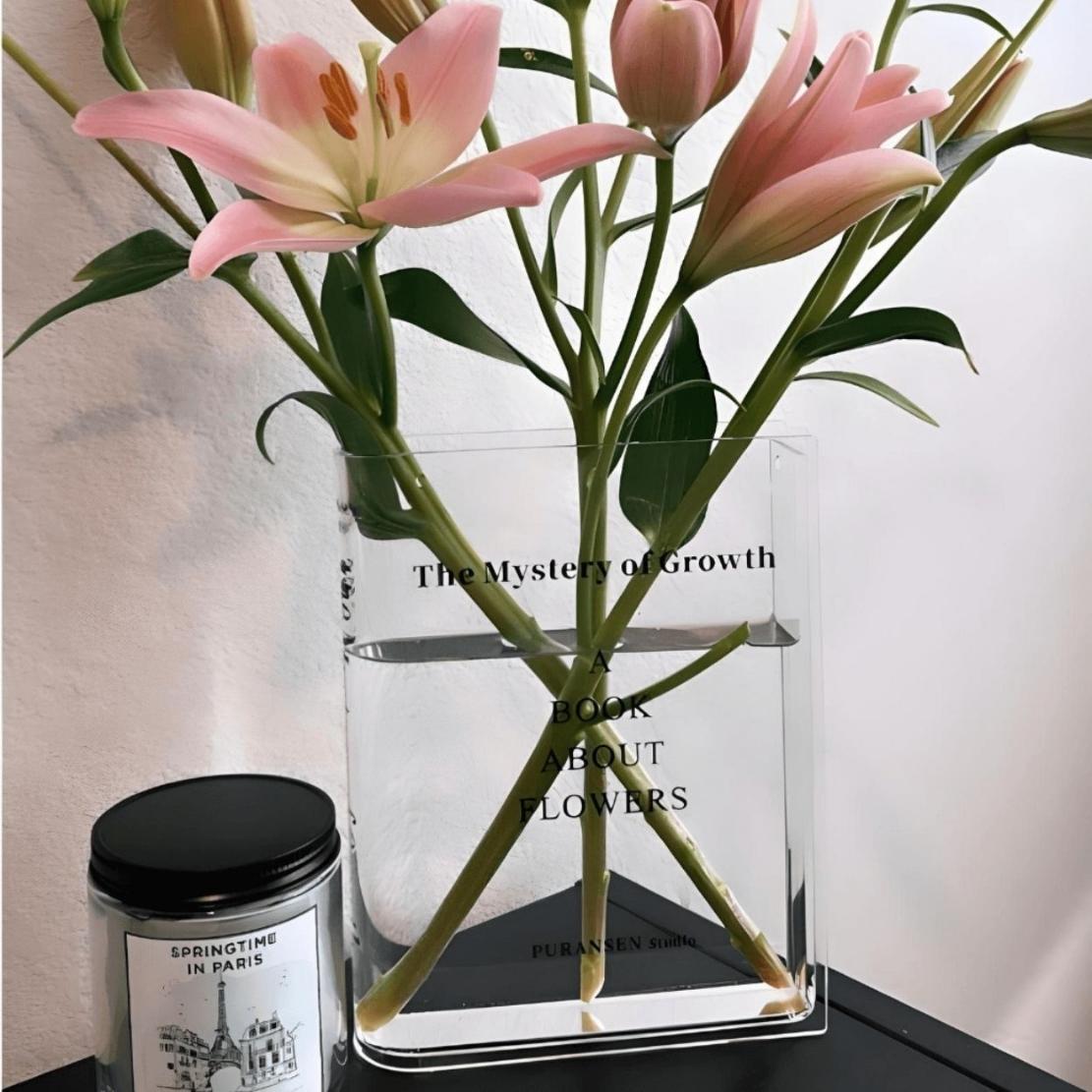 Acrylic book vase with pink flowers
