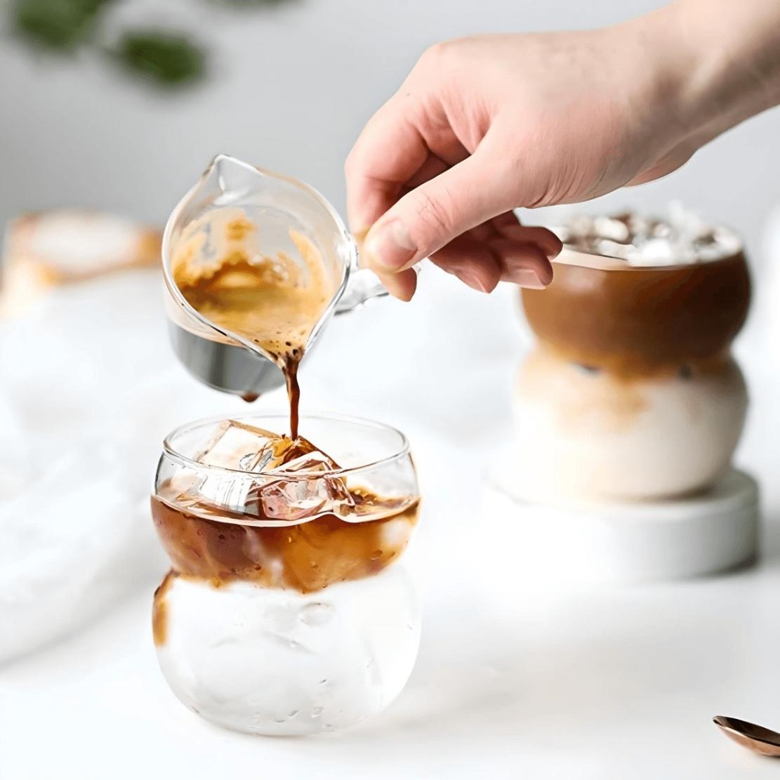 Double bubble drinking glass with ice coffee
