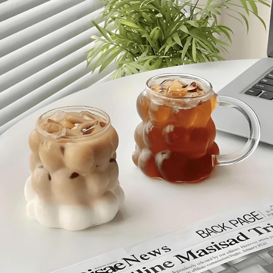 Bubble drinking glass with ice tea and coffee