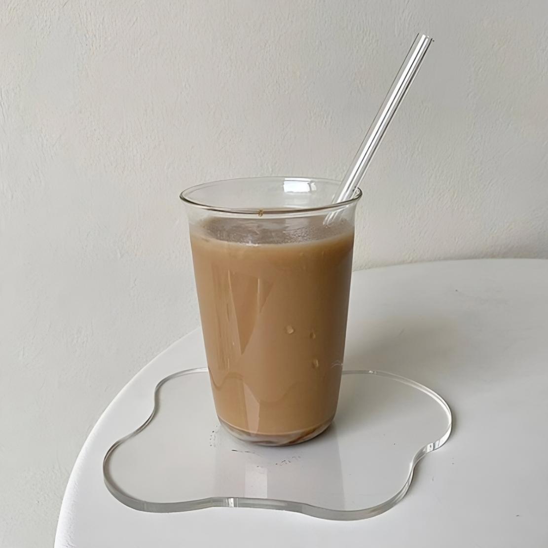 Clear irregular cup coaster with ice coffee