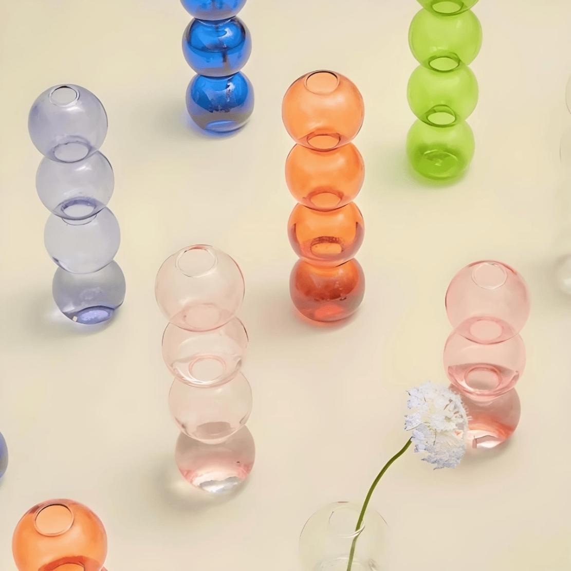 Colourful, layered ball glass vases