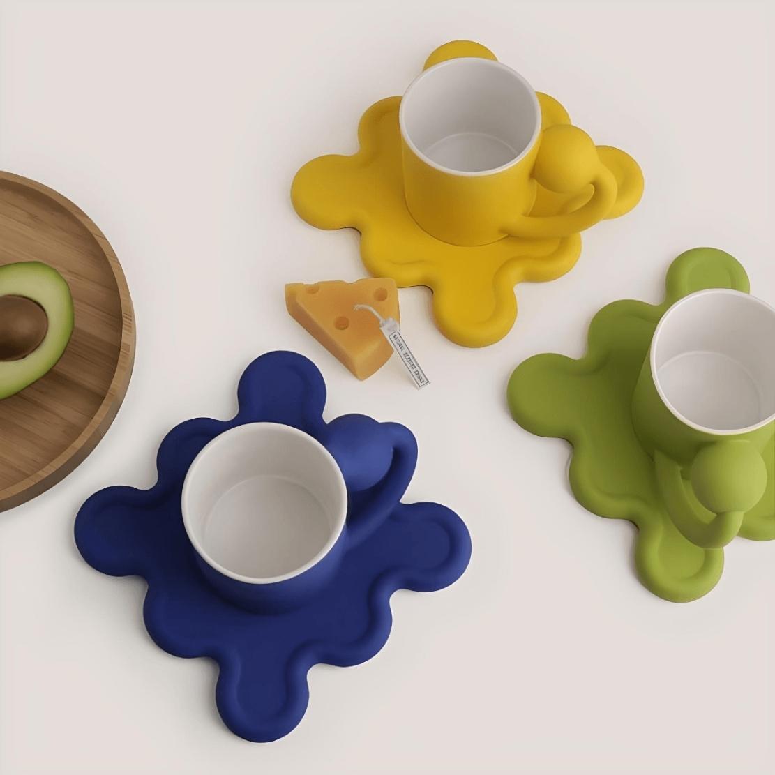 Colourful geometric ball handle mugs with wiggle wavy saucers