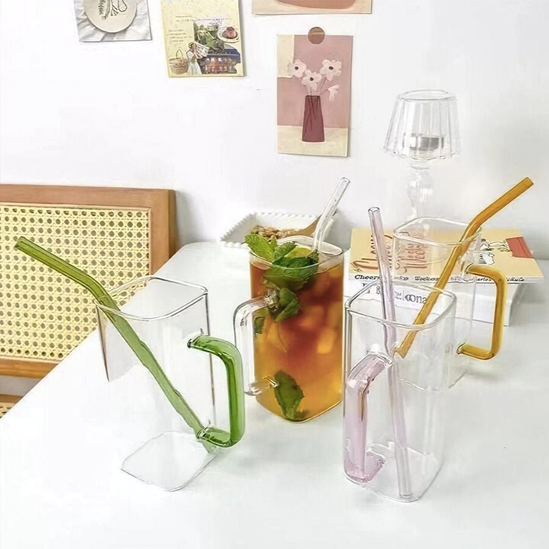 Tall square drinking glasses with colourful handles