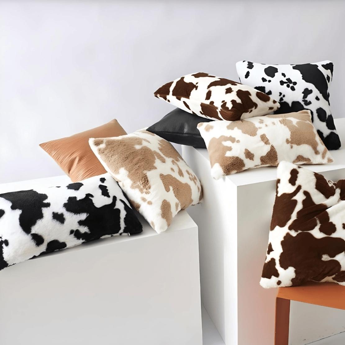Fluffy faux cow print throw pillows