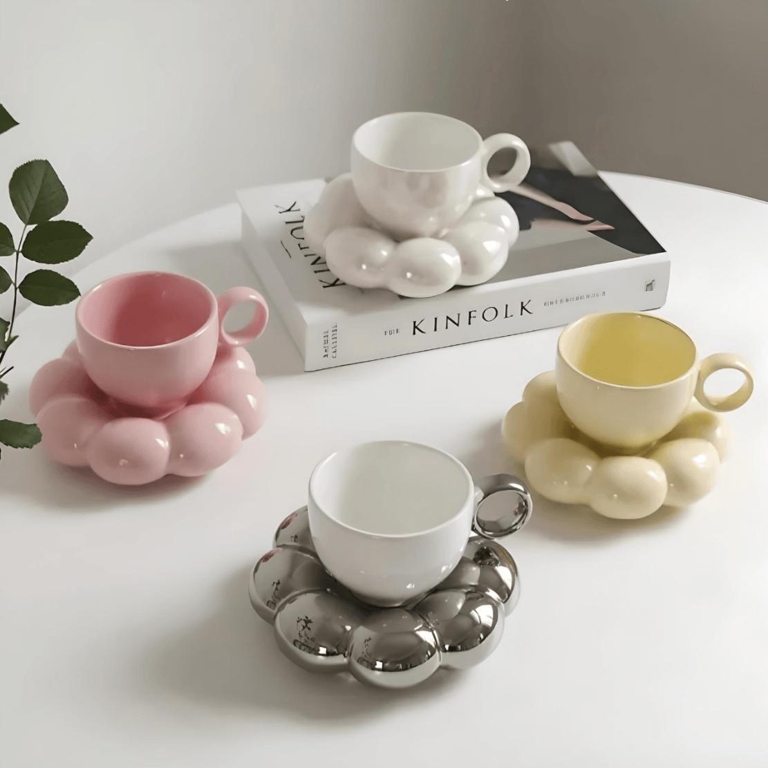 Cute pastel tea cups with flower saucers
