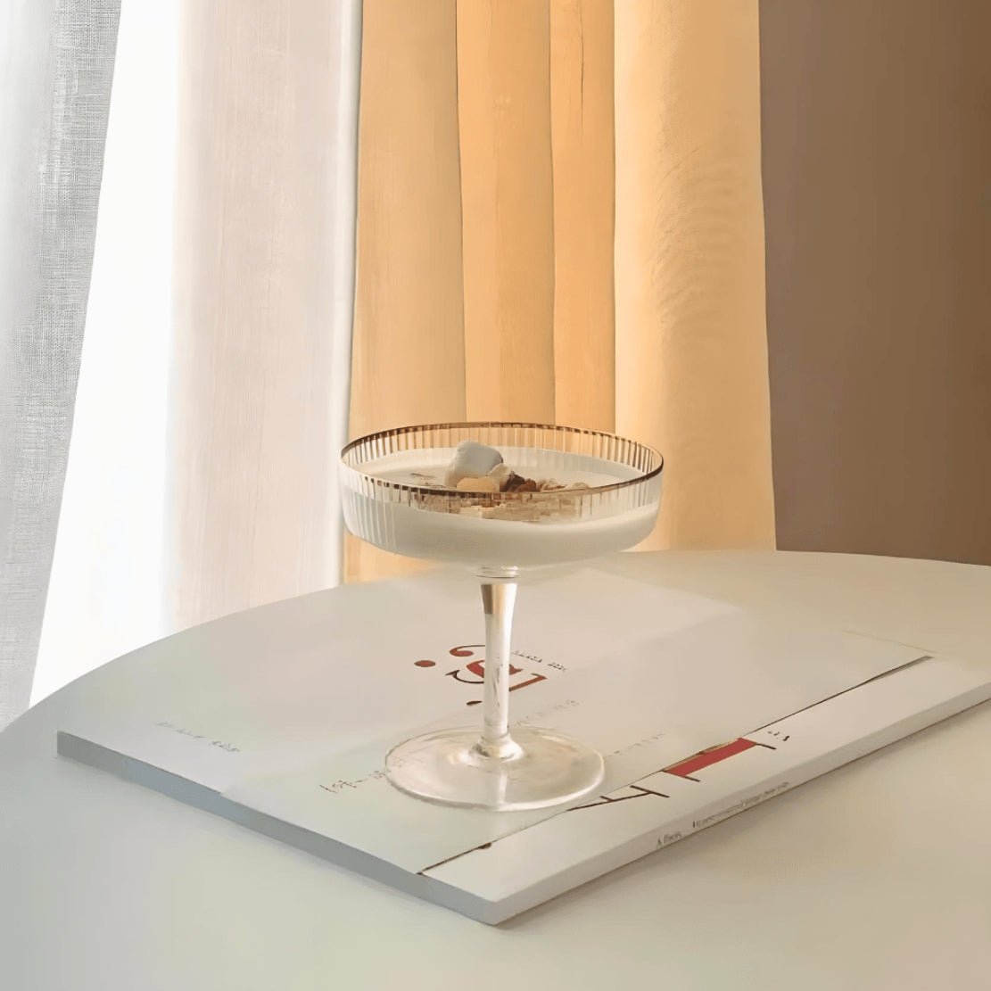 Elegant martini glass goblet with gold rim