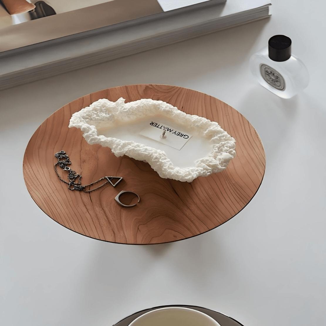 Modern wood tray with white candle and jewellery