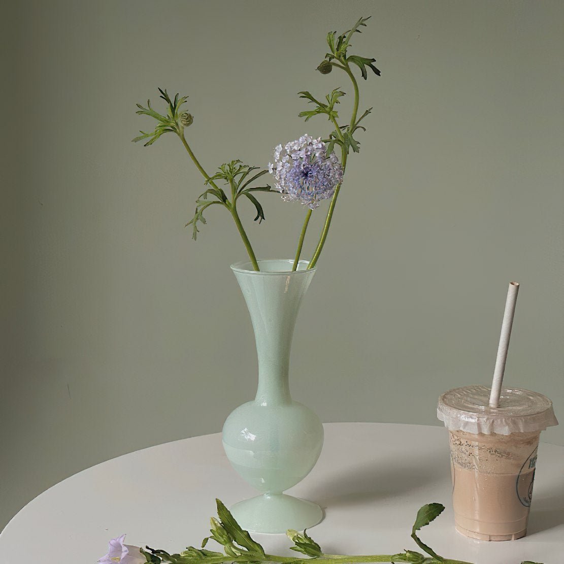 Pastel green classic flower vase with purple flower