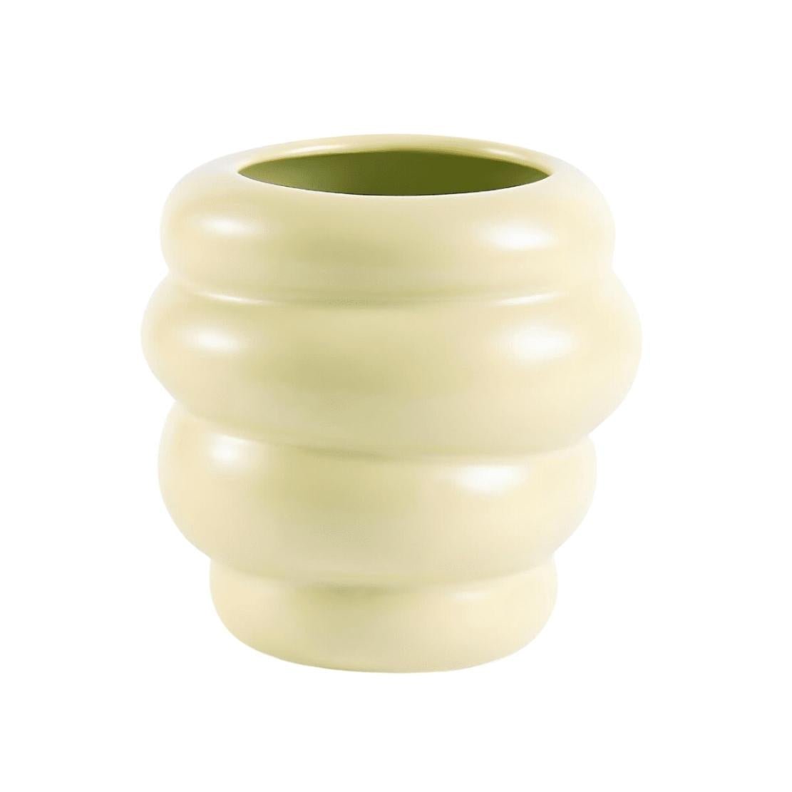 Low, green ceramic honeycomb vase