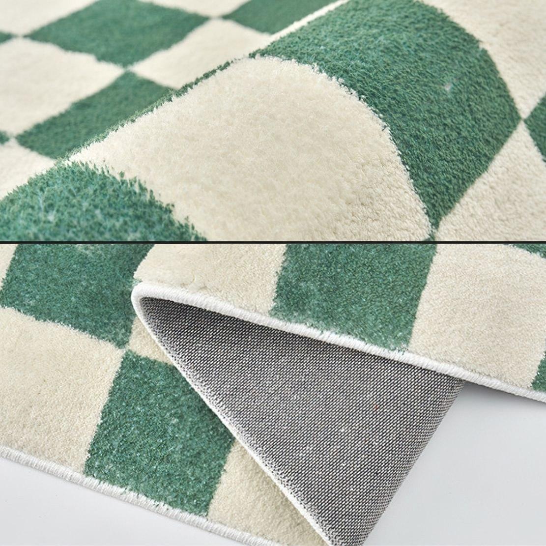 Green white checkered rug detail image