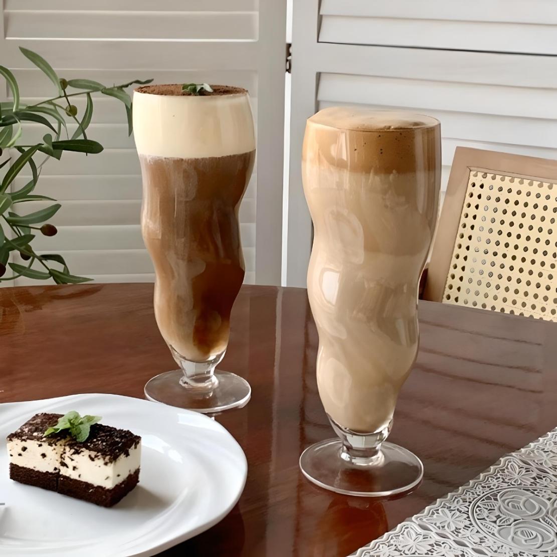 Tall, irregular trumpet shaped drinking glasses with coffee