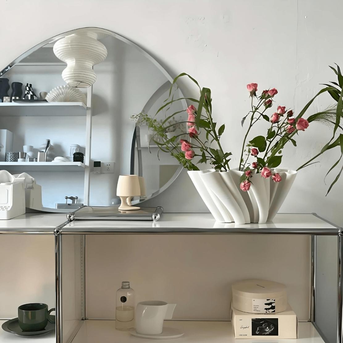 Large, ceramic wavy bowl with flowers in a modern, nordic decor room