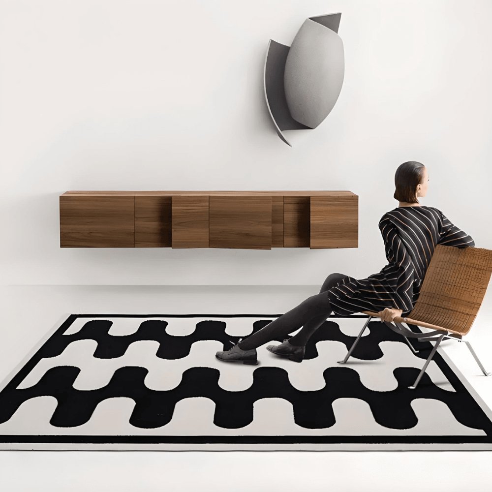 Black and white geometric retro curve design large area floor carpet with wooden furniture.