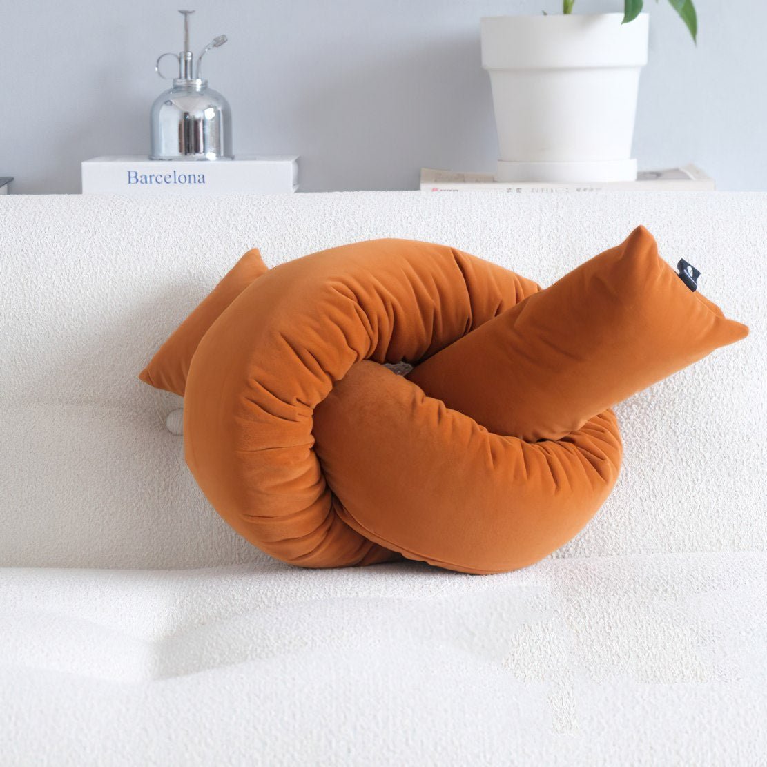 Rusty orange decorative knot throw pillow