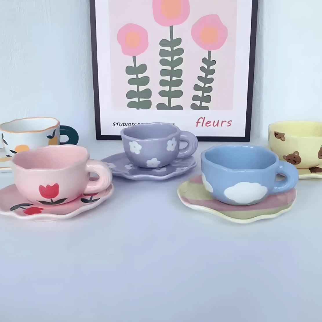Pastel, flower & cloud patterned ceramic mug with saucer