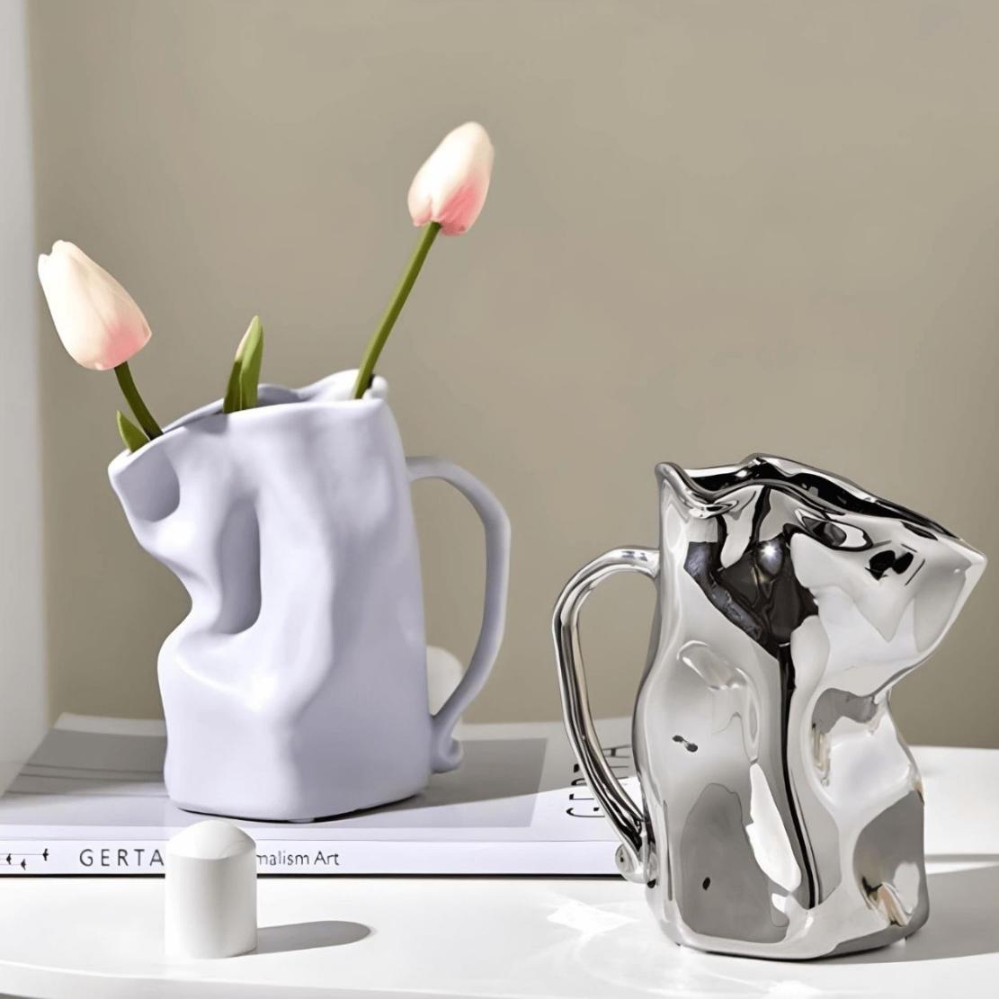 Purple and silver ceramic paper bag vases with pink tulips