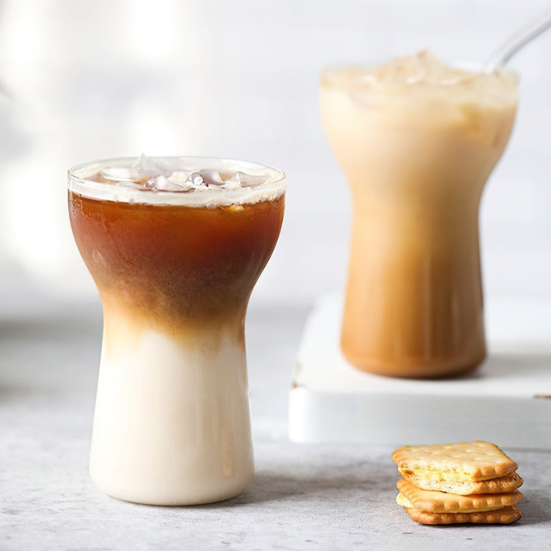 Ice cream scoop cone drinking glass with ice coffee