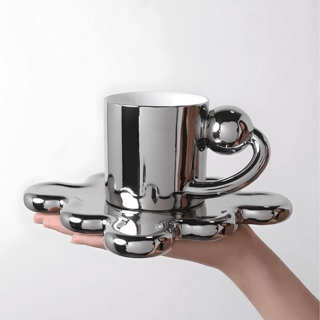 Silver ball handle mug with wavy wiggle saucer