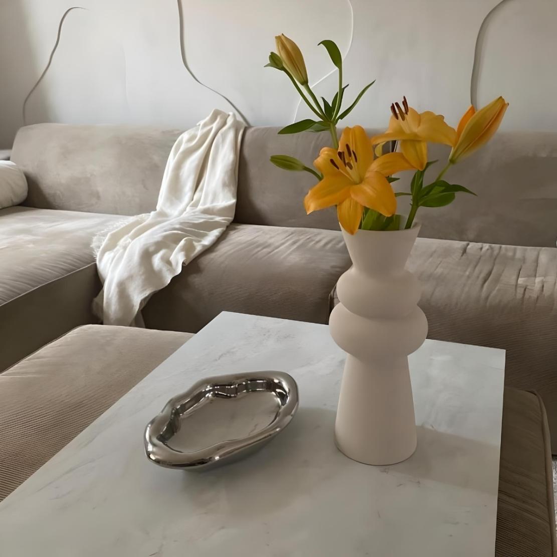 Nordic, modern livingroom with an irregular, silver, ceramic tray