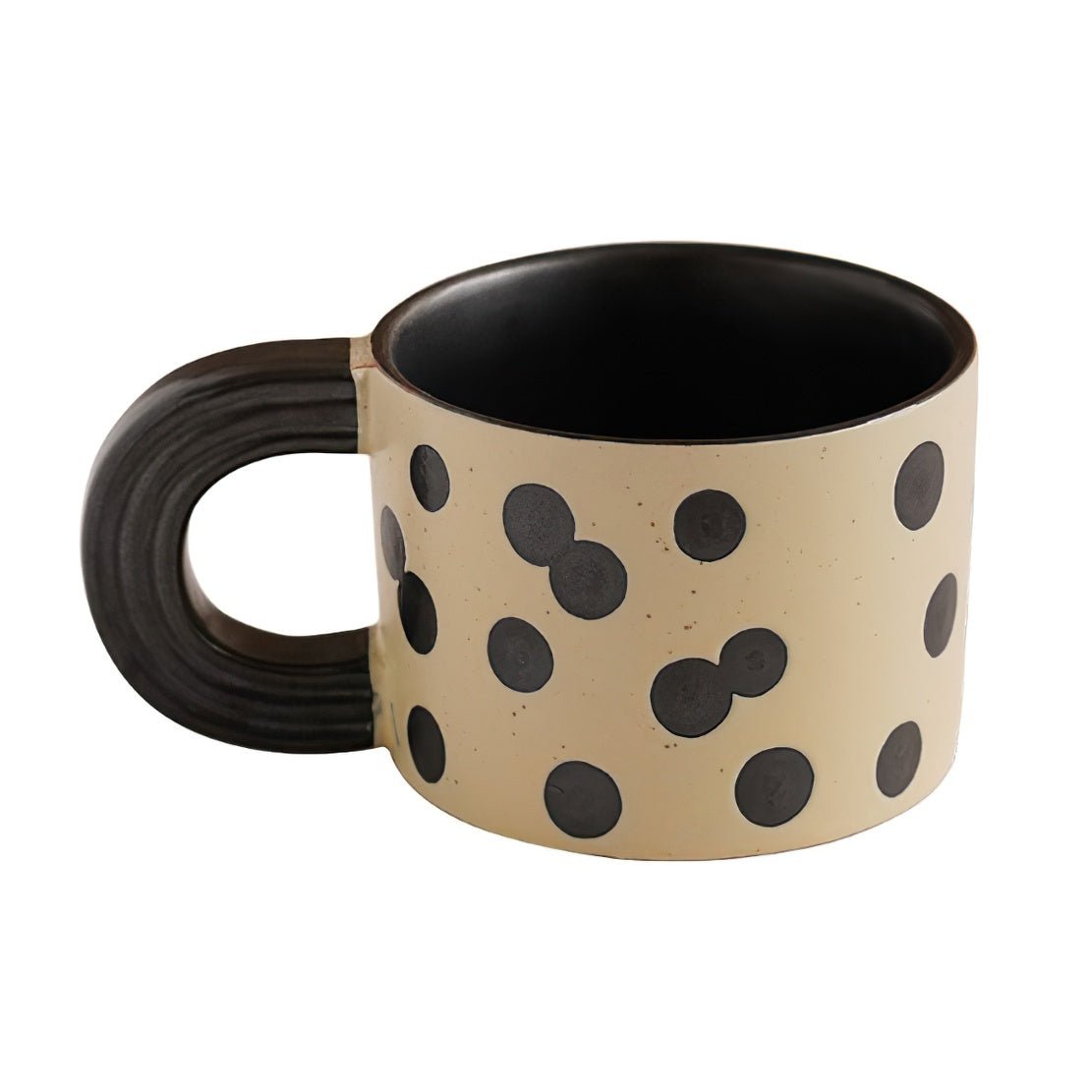 White & black ceramic polka dot mug