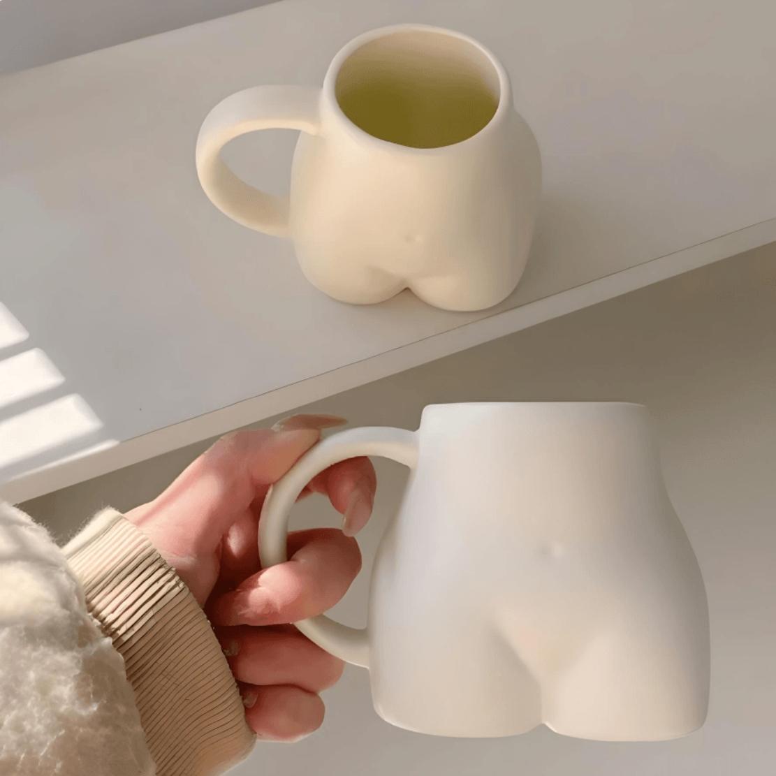 White & beige ceramic human body mug