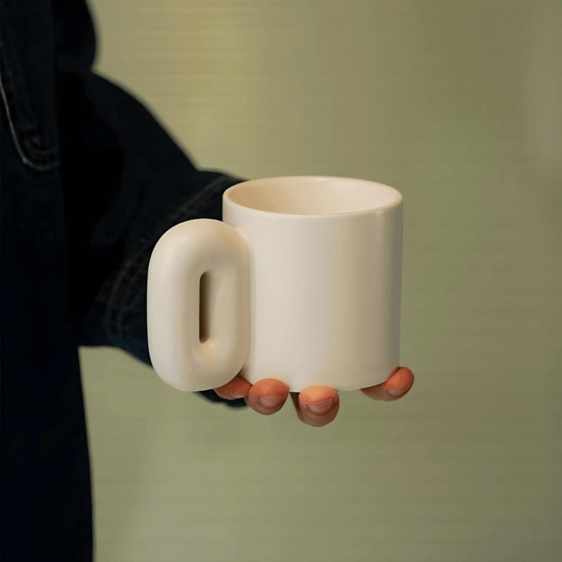White, ceramic oval shaped chunky handle mug