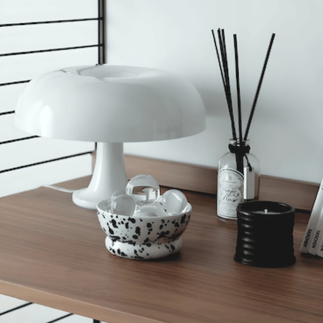 Wood table with mushroom lamp, candle and black & white splash ink ceramic food bowl