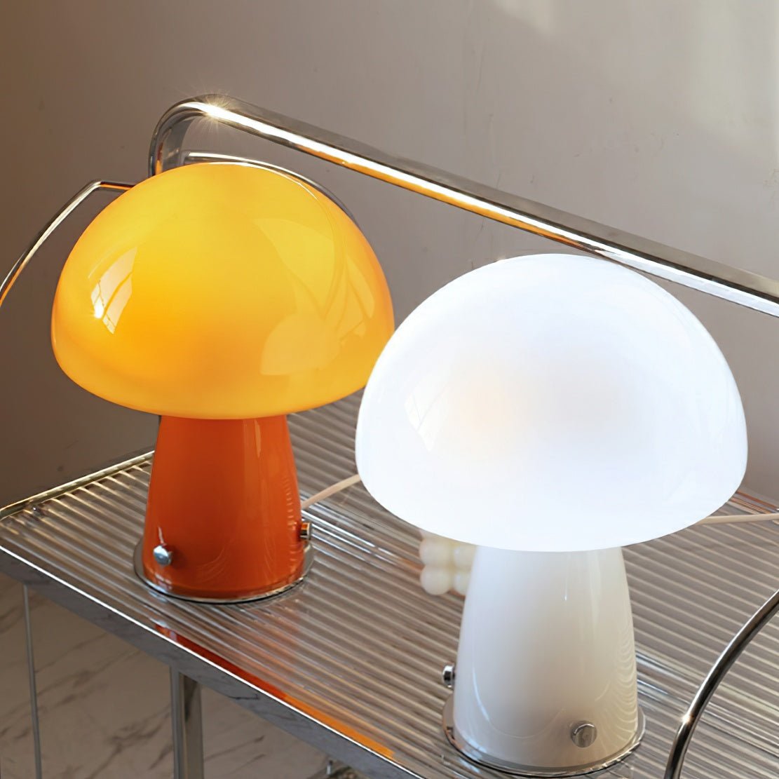 Orange & white glass retro mushroom lamps on shelf