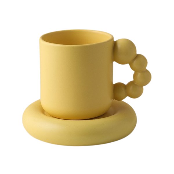 Yellow pearl handle mug with matching saucer